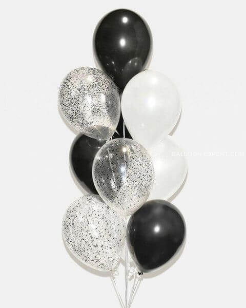 Black, silver, and white balloons on a white background